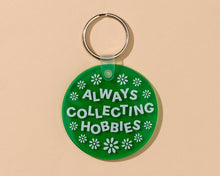 Load image into Gallery viewer, And Here We Are Soft PVC Keychains